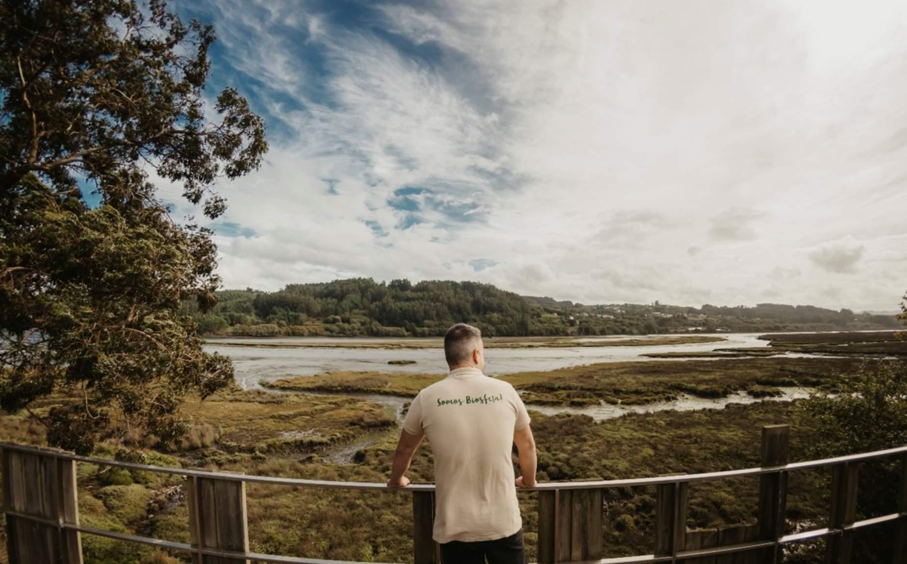 Nature guide contemplating the scenery from a lookout point